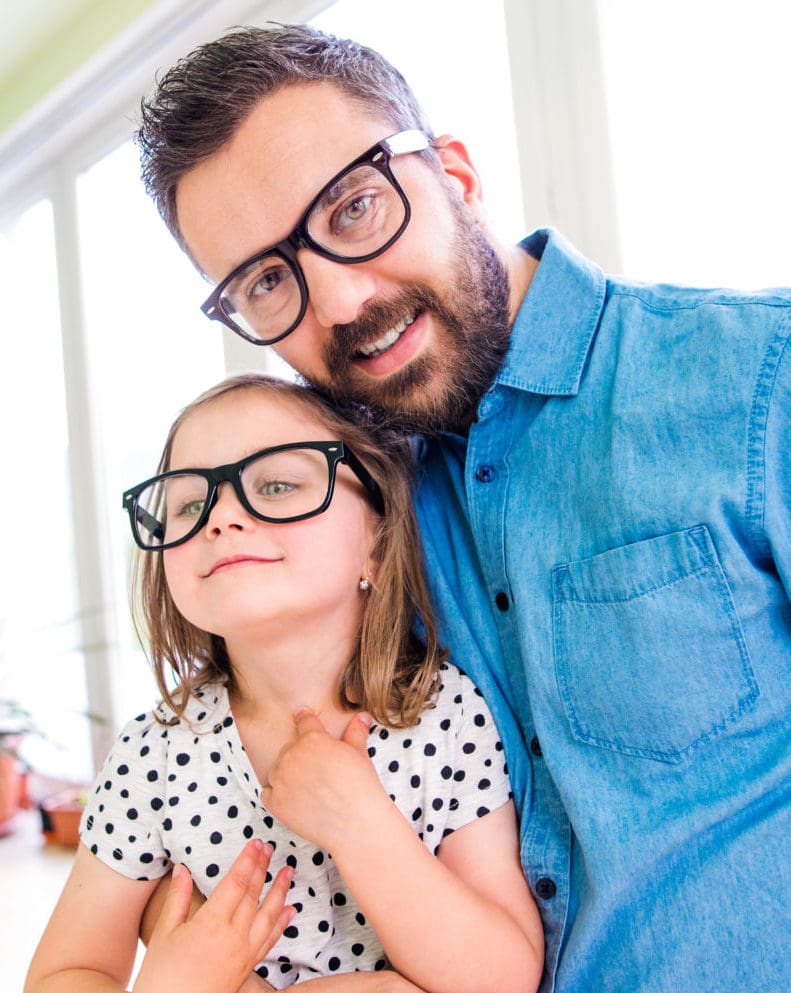 father and daughter wearing glasses